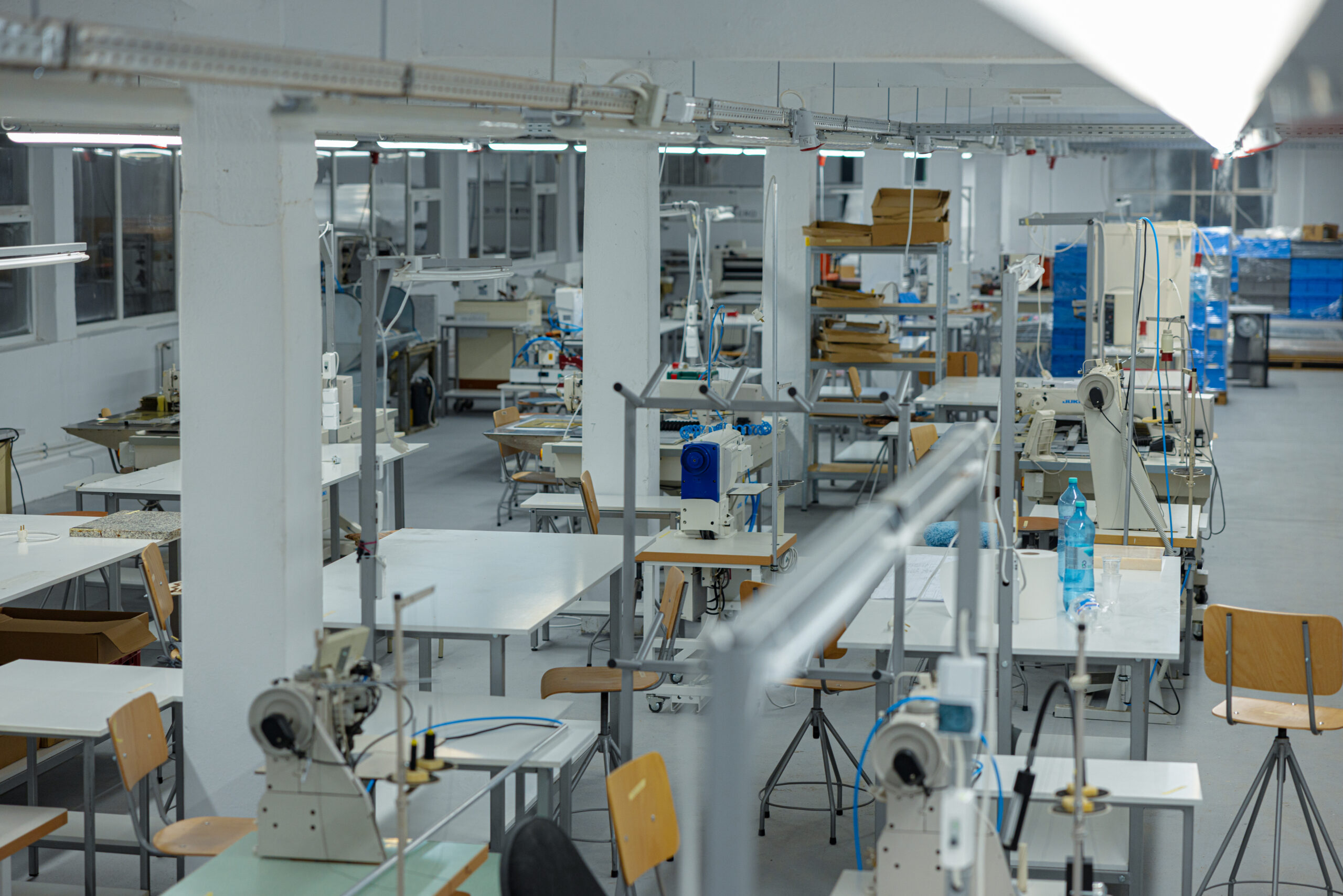 An interior of a modern factory for the manufacture of medical masks.